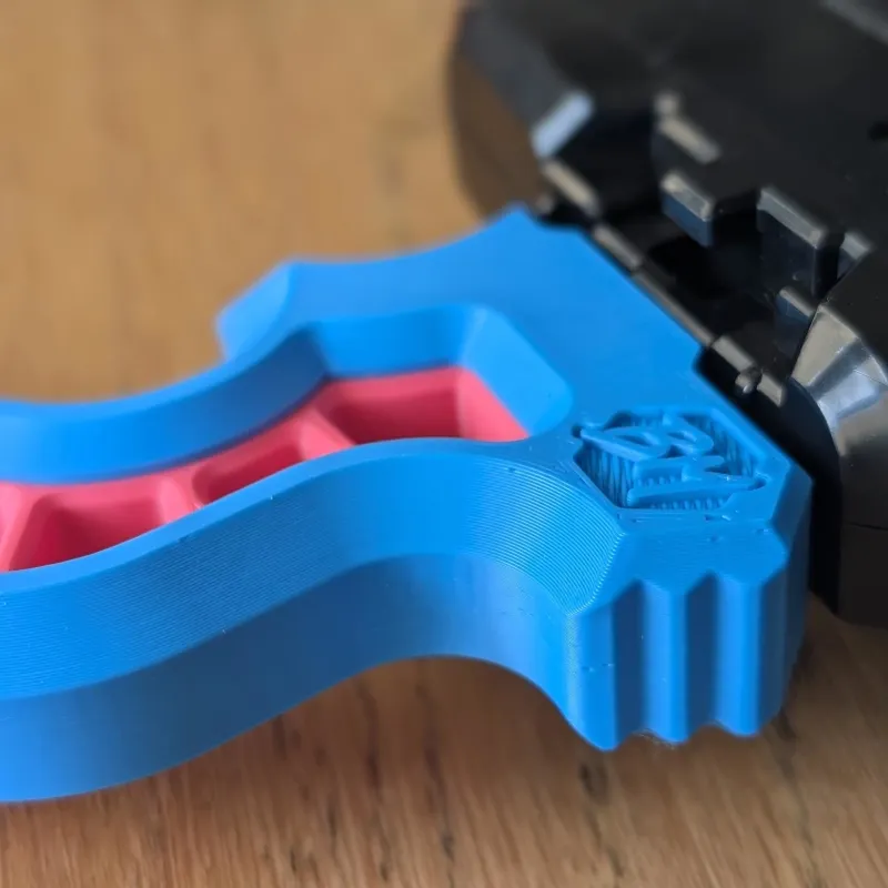 Secondary close-up highlighting ergonomic contours and angled support zones on the Beyblade X launcher grip for stability