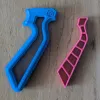 Disassembled view of the Beyblade X Skelethal winder and string grip showing internal components and modular assembly structure