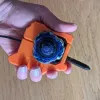 Beyblade X Bakuten Left Proto launcher grip held in hand bottom angle ergonomic view