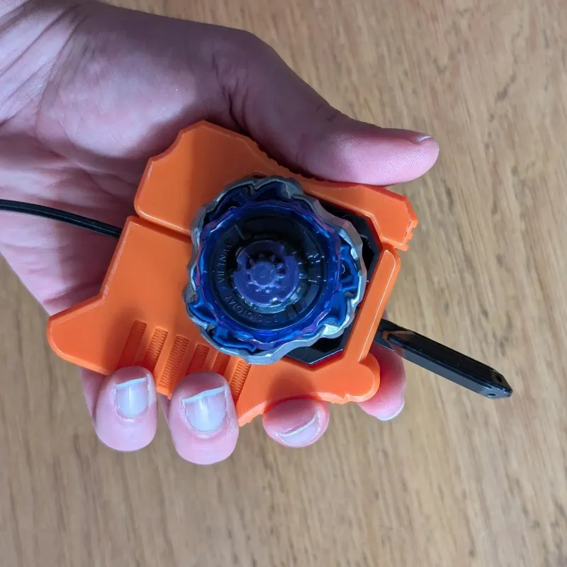 Beyblade X Bakuten Left Proto launcher grip held in hand bottom angle ergonomic view