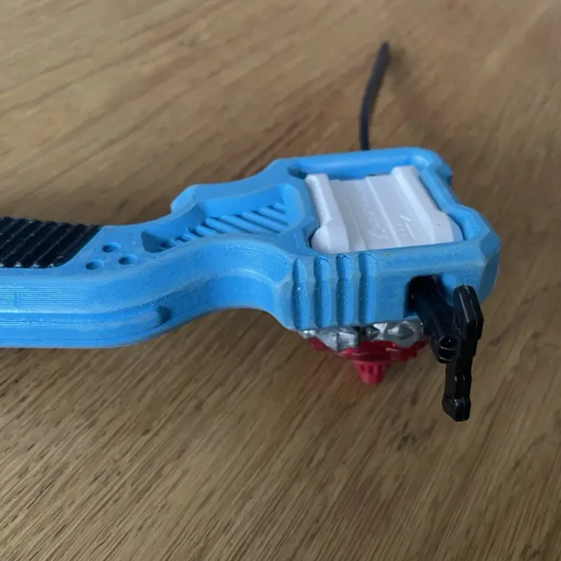 Close-up of Bakuten Proto Launcher Grip thumbrest with industrial mecha detailing