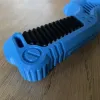 Beyblade X Bakuten-style grip detail of the handle texture : lines are carved into the ruber