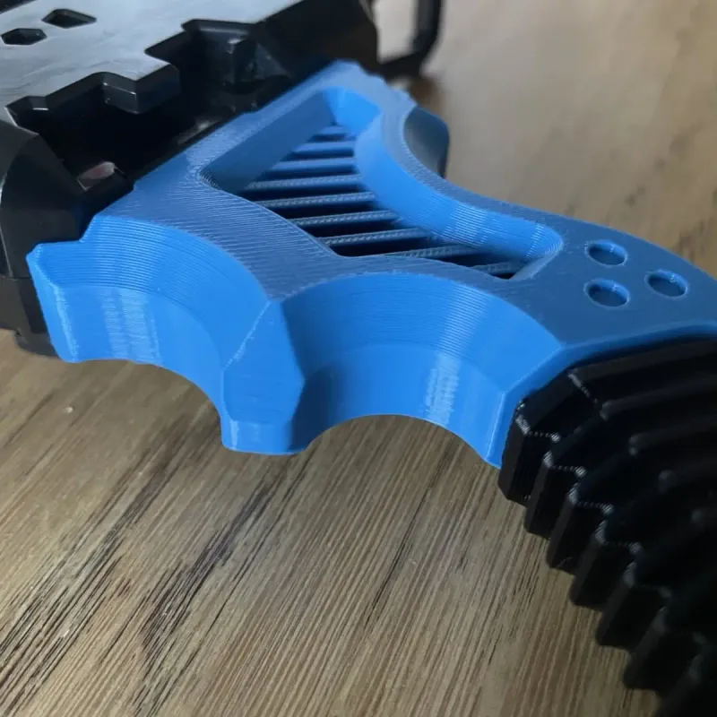 Detail of the trigger-like ergonomic protiberance on the handle