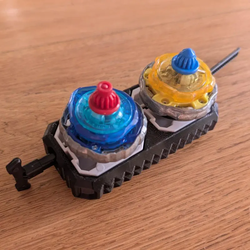 Bottom view of Beyblade X inline dual launcher grip showing launcher slots