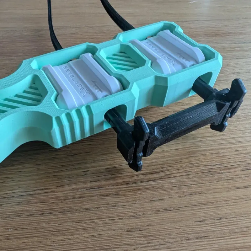 Beyblade X dual proto launcher grip detail view showing the link between two ripcords and the cooling grids features