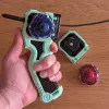 Left-hand view of Inline Modular Dual Proto Launcher Grip with single Beyblade X loaded