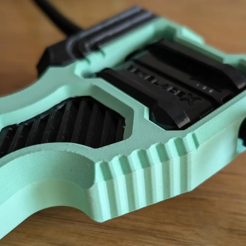Detail view of thumbrest on Inline Modular Dual Proto Launcher Grip for improved control