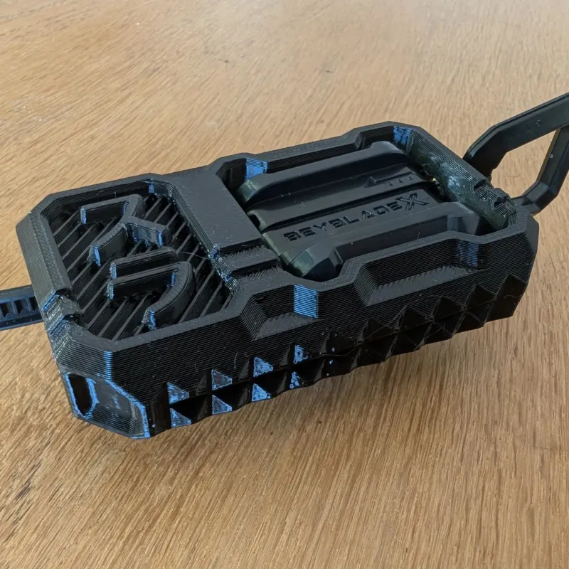 Beyblade X Inline Proto Launcher Grip close-up showing thumb and index finger pockets