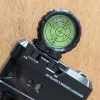 A beyblade X winder launcher with the leveling scope mounted
