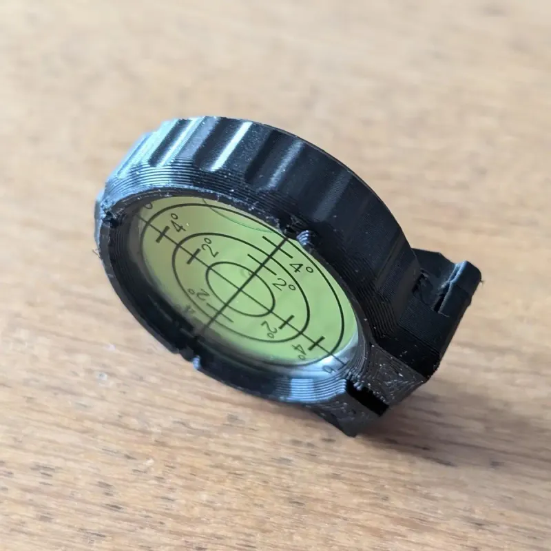 Beblade X leveling scope, detached from the launcher, a vial contains a bubble and an angle scale