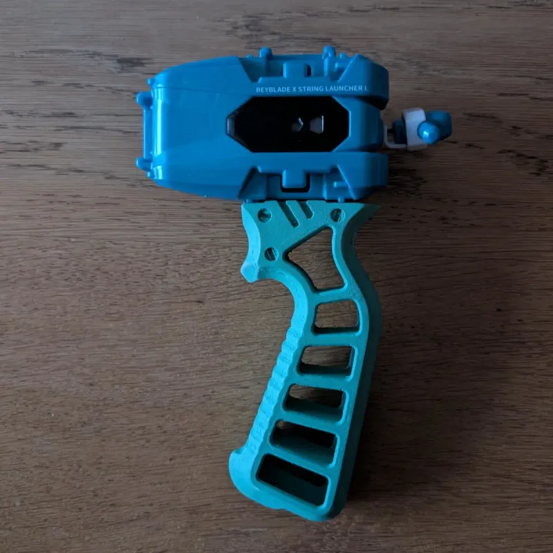 Close top-down look at Beyblade X Skelethal Winder Launcher Grip surface topology