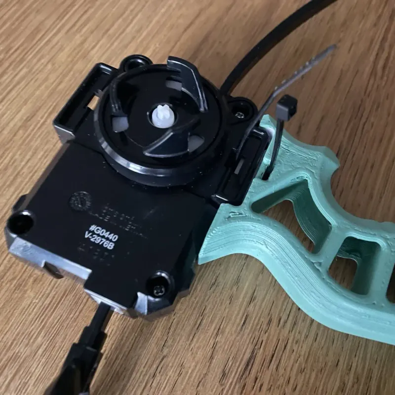 Beyblade X Skelethal Winder Launcher Grip showing how to secure it to the launcher using a ziptie