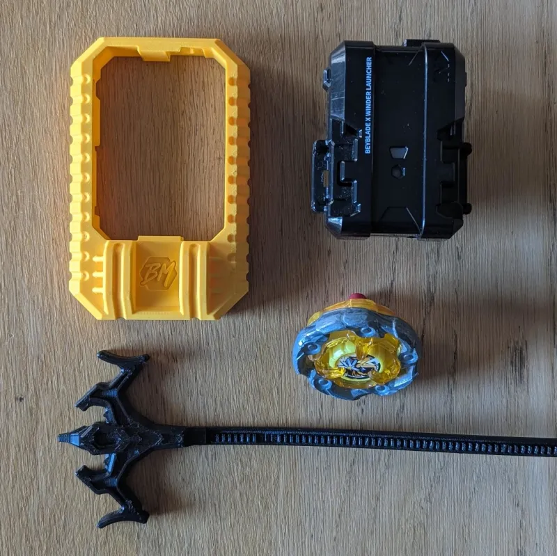 Disassembled top view of Beyblade X inline launcher grip and Winder Launcher R assembly parts