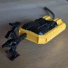 Front angle of custom Beyblade X launcher grip highlighting recessed thumb rest and widened body