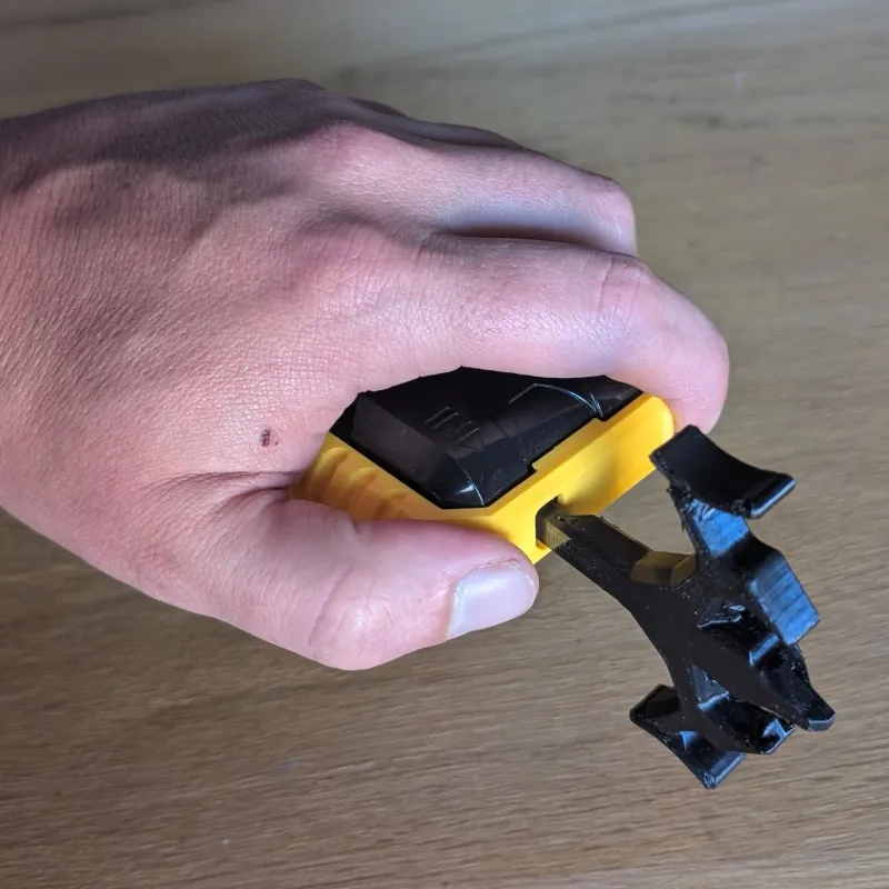 Handheld top view of Beyblade X Winder Launcher R grip demonstrating full-hand ergonomic support