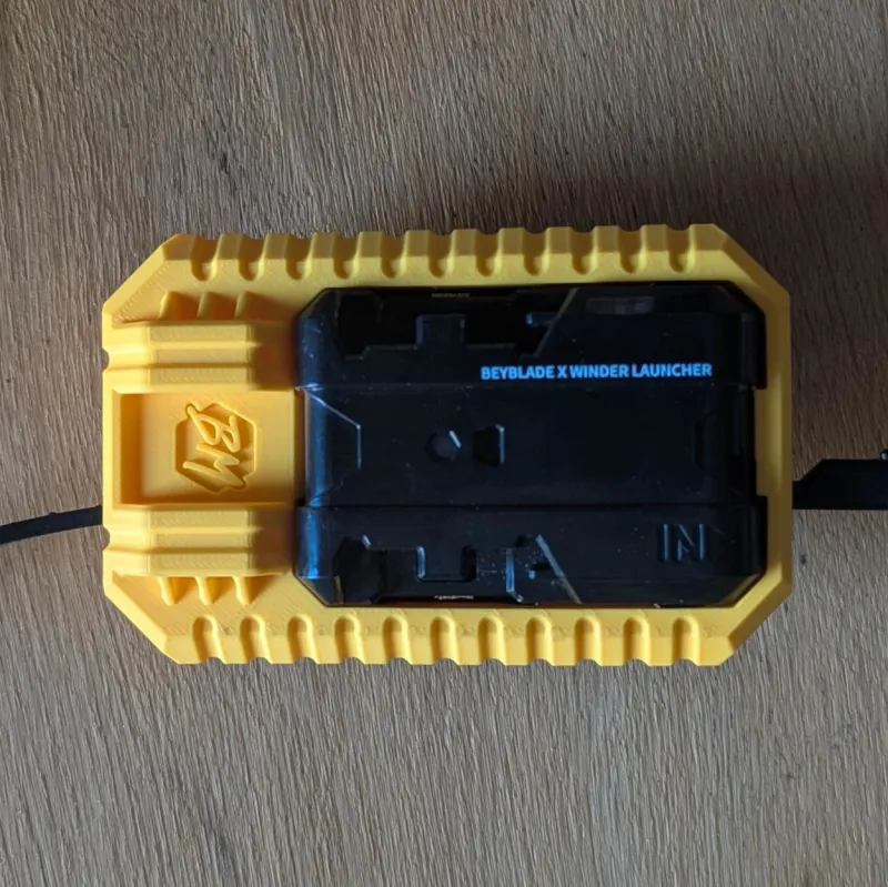 Top view of Beyblade X inline launcher grip with industrial pod inspired shell and control-focused layout