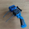 Beyblade X Double Winder Launcher Link angled view mounted with two Beyblades ready for synchronized launch